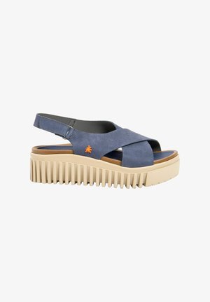 Sandale plateforme en cuir bleu avec brides croisées, semelle beige rainurée et logo fleur orange sur le côté.