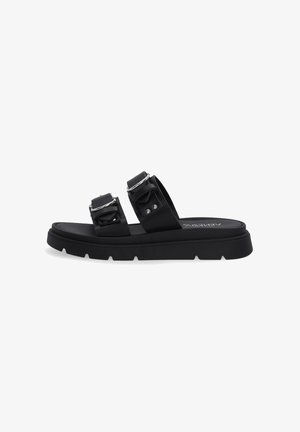Black slide sandals feature two wide straps with buckles and a chunky rubber sole, positioned on a plain white background.