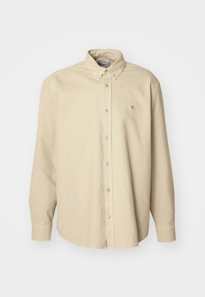 Beige lange mouwen knoopshirts gemaakt van zachte katoen met een klassieke kraag en een afgeronde zoom, met een klein logo op de borst.