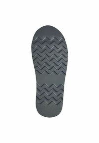 Grå gummisko sula med en texturerad yta och zigzag-mönster för grepp, med rundad tå och formad häl.