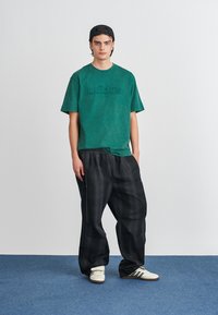 adidas Originals FIREBIRD - Spodnji deli trenirk - black