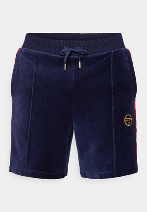 Navy blue velour shorts with a drawstring waistband, red side accents, and a gold logo patch on the left leg. Smooth texture.