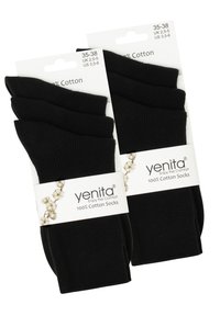 Calzini neri in cotone in confezione da quattro, con una texture a coste, etichette attaccate che mostrano le opzioni di taglia e dettagli di branding.