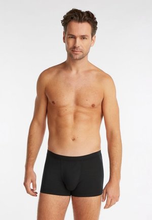 Zwarte katoenen boxershorts met een strakke pasvorm, voorzien van een zachte elastische tailleband en een gladde textuur, geschikt voor dagelijks gebruik.