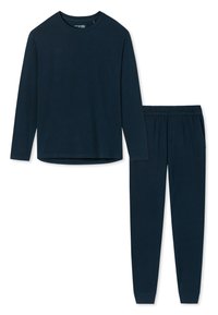 Marinfärgad långärmad topp och matchande byxor i mjuk bomull. Toppen har en rund halsringning; byxorna har resår i midjan och smalnande anklar.