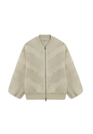 Veste bomber beige avec un motif zigzag texturé, un col côtelé, des poignets élastiques et une fermeture éclair sur le devant. Tissu doux avec une apparence légère.