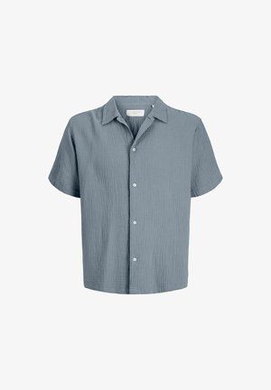 Chemise à manches courtes, bleu clair texturée, boutonnée avec col, présentée sur un fond blanc.