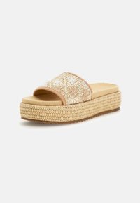 Infradito da piattaforma in beige con texture intrecciata. Caratterizzate da una ampia fascia e suola testurizzata, che evidenziano le fibre naturali e una soletta imbottita.