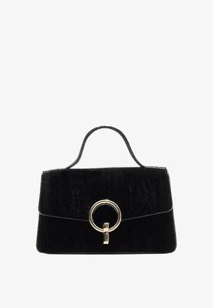 Black velvet handbag with a structured design, a top handle, and a gold circular clasp detail on the front. Smooth texture.