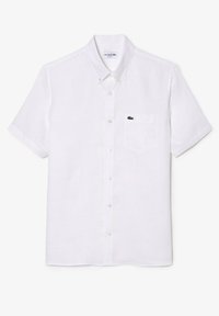 Camicia bianca a maniche corte con bottoni in tessuto leggero, dotata di una tasca sul petto sinistro con un piccolo logo verde Lacoste.