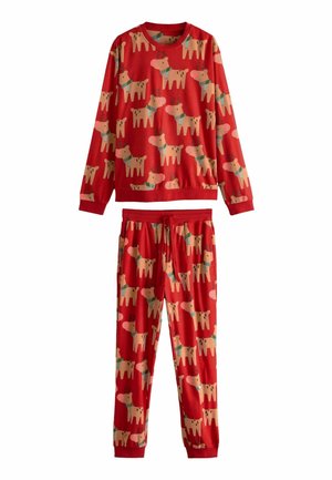 Roter Baumwoll-Pyjama mit langen Ärmeln und elastischem Bund, der ein verspieltes Muster aus stilisierten, bunten Hunden zeigt.