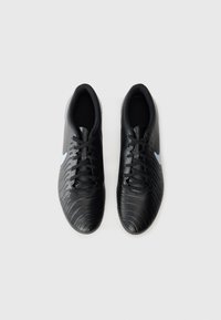 Black athletic shoes with textured surface, round toe, and lace-up design. Features light blue Nike logo on the side.