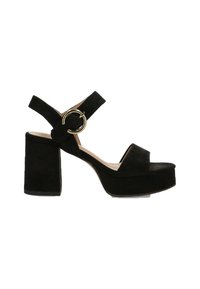 Sandalia de plataforma de ante negro con tacón grueso, tira ajustable al tobillo y detalle de hardware dorado circular. Textura suave y diseño sencillo.