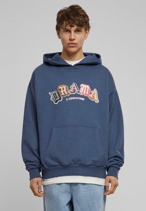 Blue hoodie with front pocket, featuring the text "DRAMA I CHOOSE" in multi-colored lettering. Long sleeves and ribbed hem. Casual fit.