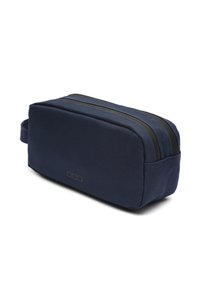 Borsa da toeletta rettangolare blu navy realizzata in tessuto testurizzato, con doppie cerniere nere e una maniglia laterale per un facile trasporto.