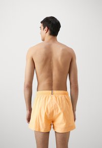BOSS MOONEYE - Plavecké šortky - medium orange