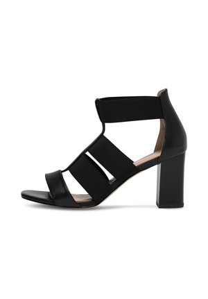 Czarna sandałka na wysokim obcasie z elastycznymi paskami, odkrytymi palcami i masywnym obcasem. Gładka skóra i rozciągliwy materiał zapewniają komfort.