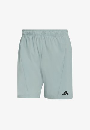 Light grey athletic shorts with an elastic waistband, featuring a black Adidas logo and angled side seams for a modern fit.