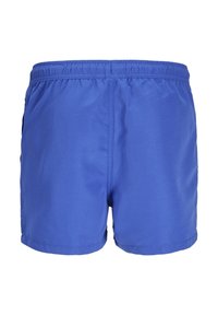 Bañador azul con cinturilla elástica, corte corto y textura suave, con un diseño simple y sin patrones ni acentos visibles.