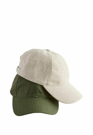 Two caps stacked: one beige linen cap with a curved brim, and one olive green cotton cap with a similar shape and texture.