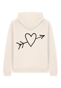 Felpa color crema con un design di un cuore nero con una freccia sul retro, realizzata in un tessuto morbido con polsini e vita a coste.