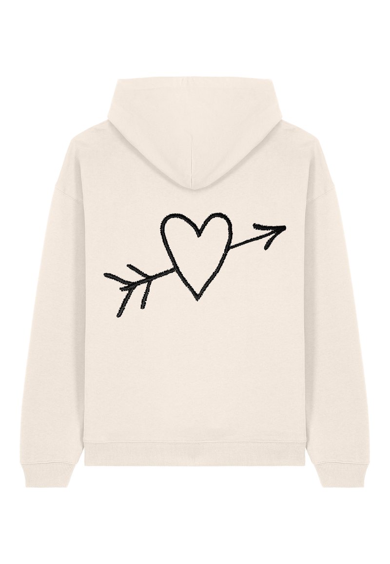 Felpa color crema con un design di un cuore nero con una freccia sul retro, realizzata in un tessuto morbido con polsini e vita a coste.