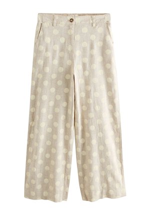 Pantalon beige à jambes larges avec de petits pois clairs, passants pour ceinture, poches latérales et fermeture à boutons à l'avant.