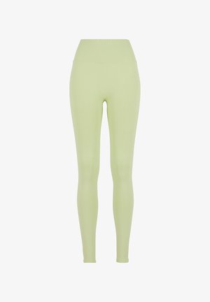 Lysgrønne leggings lavet af strækbart materiale med en bred, ribbet talje. Glat tekstur og tætsiddende design.