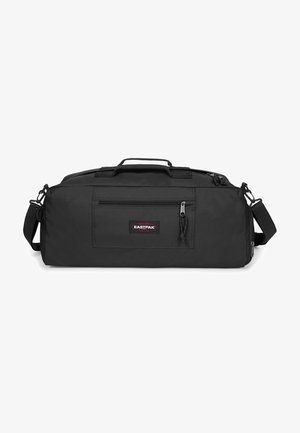 Black duffel bag with a durable fabric, zippered main compartment, front pocket, and adjustable shoulder strap. Features a logo patch.