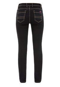 Zwarte skinny jeans met een gladde textuur, met twee achterzakken met contrasterende gele stiksels en een tailleband met lussen.