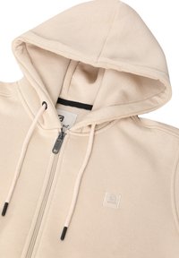 Felpa con cappuccio beige con zip completa, lacci con punte nere e un piccolo patch con il brand sul petto. Tessuto morbido.