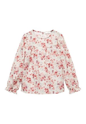 Blouse blanche à manches longues avec imprimé floral rose et rouge, encolure ronde, poignets volantés et empiècement sur la poitrine et les épaules.