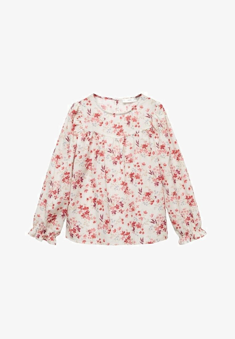 Blouse blanche à manches longues avec imprimé floral rose et rouge, encolure ronde, poignets volantés et empiècement sur la poitrine et les épaules.