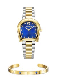Orologio oro e argento con quadrante blu, dotato di accenti dorati e gemme; accompagnato da un bracciale rigido in oro con pietre blu.