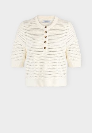 Κρεμ πλεκτό πουλόβερ με κοντά μανίκια, λοξό κούμπωμα με κουμπιά, ριμπ λαιμόκοψη και τελείωμα, με υφή ανοιχτού πλεξίματος.