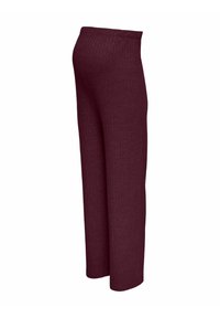 Pantalon large côtelé couleur marron avec une taille élastique. Texture douce, coupe longue, avec des motifs verticaux sur toute la surface.