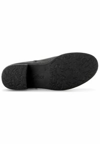 Suela de zapato de goma negra con dibujo texturizado para mayor agarre. Presenta el nombre de la marca grabado "Gabor" y un leve tacón para estabilidad.