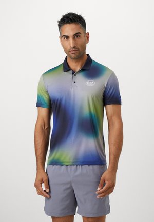 Short-sleeve polo shirt in gradient blue, green, and gray. Features a navy collar and EA7 logo on the left chest. Smooth fabric texture.