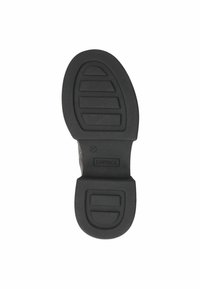 Suela de zapato de goma negra que presenta un patrón de banda de rodadura con ranuras horizontales y un logo que dice "CAPRICE", con la talla 37 estampada cerca del talón.