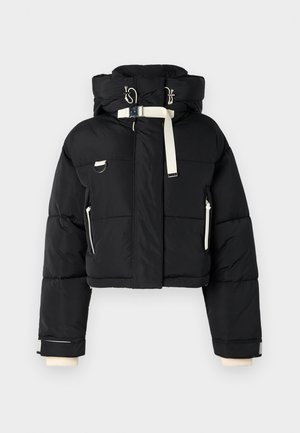 Black cropped puffer jacket with a hood, featuring cream color accents, front zipper, side pockets, and elastic cuffs.