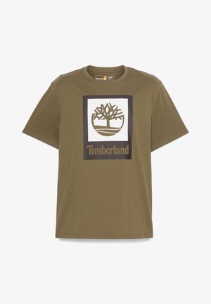 Olive green cotton t-shirt with short sleeves, featuring a white square logo design with a tree and "Timberland" text at the bottom.