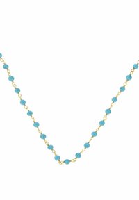 Collana di perle turchesi con catena dorata, caratterizzata da perle rotonde ben distanziate, superficie liscia e un design delicato.