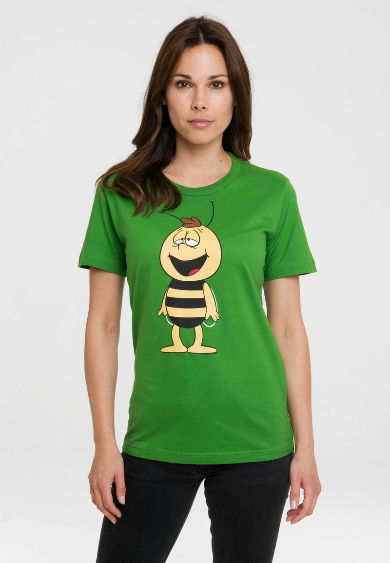 Green cotton t-shirt featuring a cartoon bee with a black-and-yellow striped body, smiling expression, and antennae on the front.