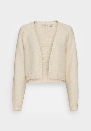 Cardigan crème en grosse maille avec ouverture devant, manches longues et poignets et ourlet côtelés.