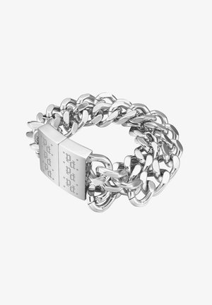 Thick silver chain-link bracelet with a large rectangular clasp engraved with decorative dots and letters.