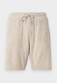 Pantalones cortos de rizo beige con cinturilla elástica y cordón ajustable. Presenta un bolsillo delantero y un diseño hasta la rodilla.
