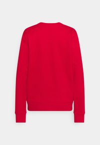 Rode sweatshirt met een ronde hals en lange mouwen. Gemaakt van een gladde stof met een licht gestructureerde afwerking. Geen zichtbare logo's of ontwerpen.