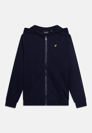 Felpa con zip di colore blu navy, con tasca a marsupio, polsini a coste e cappuccio. Presenta un piccolo logo giallo ricamato sul petto. Tessuto morbido.