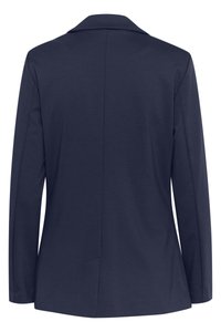 Tmavě modrý dámský blazer s dlouhými rukávy, centrálním švem na zádech a klopovým límcem, zobrazený zezadu na bílém pozadí.
