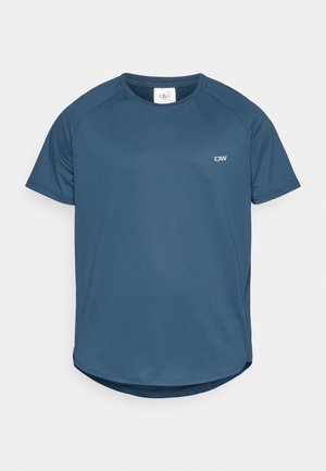 T-shirt desportivo de manga curta em azul-marinho, em tecido texturizado, com gola redonda e barra arredondada. Apresenta um pequeno logotipo no peito.